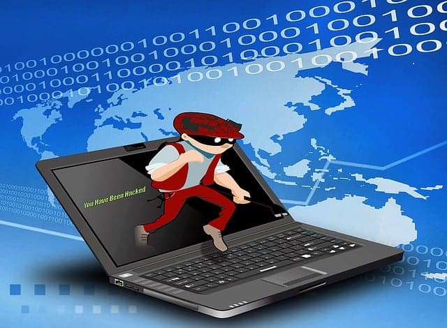 Cartoon image of a burglar coming out of a laptop
